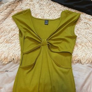 Long green dress with two cut outs.